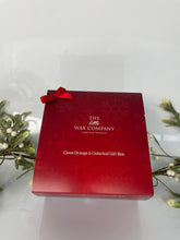 Red gift box with 'The Wax Company' branding on a white background
