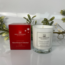 Candle and packaging of The Little Wax Company with clove orange & cedarleaf fragrance on a white background.