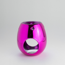 A pink wax melt burner with a glossy finish, designed to hold a lit tea-light underneath for melting the wax.