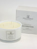 A large, white, round soy wax candle with three wicks, labeled 'Peony & Blush Suede', presented next to its packaging box which has 'The Little Wax Company' branding.